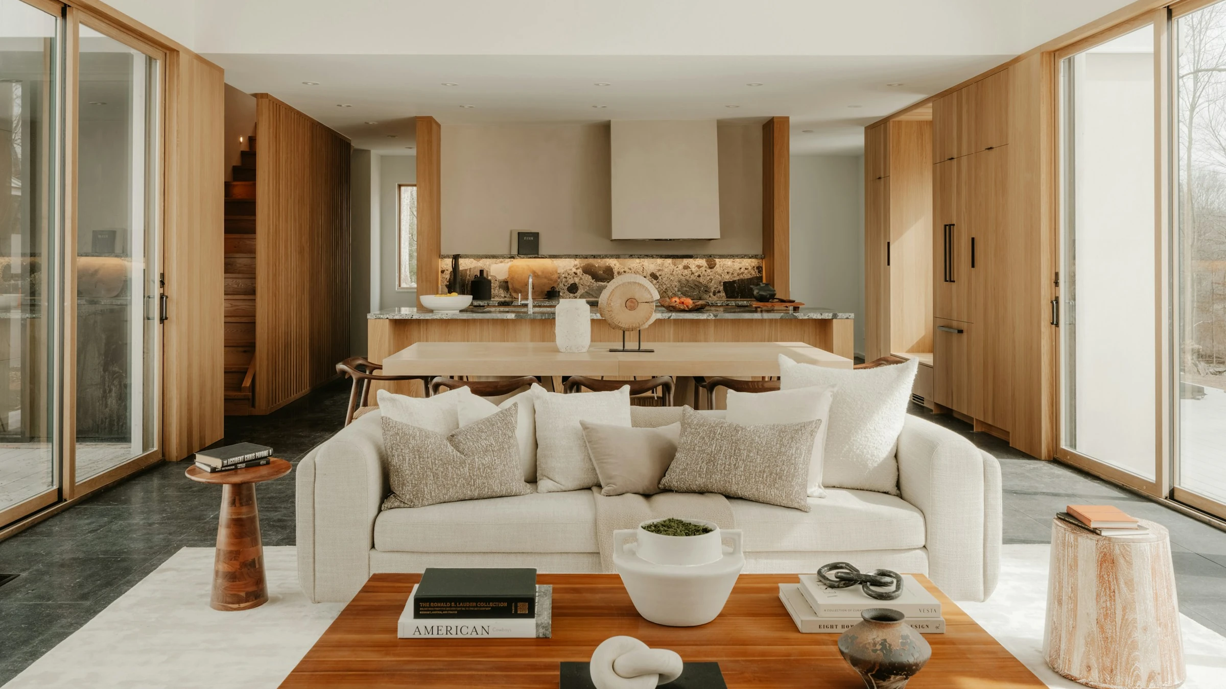 A finished open plan living and kitchen space in warm timber