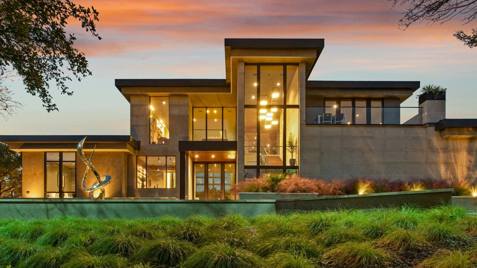 A well maintained modern property lit at dusk